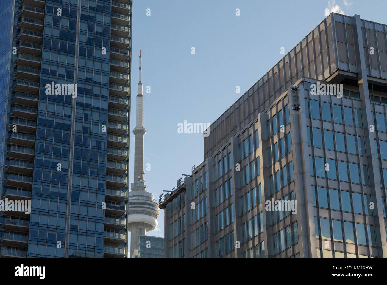 TORONTO, CANADA - DECEMBER 20, 2016: Canadian National Tower (CN Tower) surrounded by more modern buildings in downtown Toronto. CN Tower is the talle Stock Photo