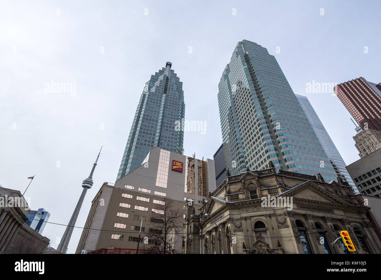 TORONTO, CANADA - DECEMBER 31, 2016: CIBC center with the CN Tower in background in the center of Toronto. CIBC, or Canadian Imperial Bank of Commerce Stock Photo