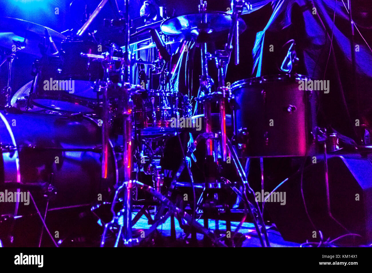 View of drum set on stage in blue light  before a concert. Stock Photo