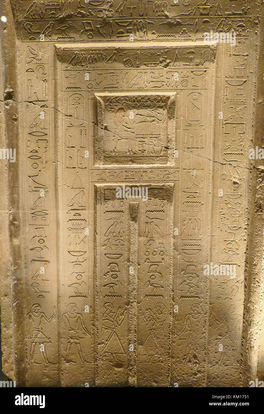 Egyptian hieroglyphics on the stonedoor of an ancient Egyptian tomb Stock Photo