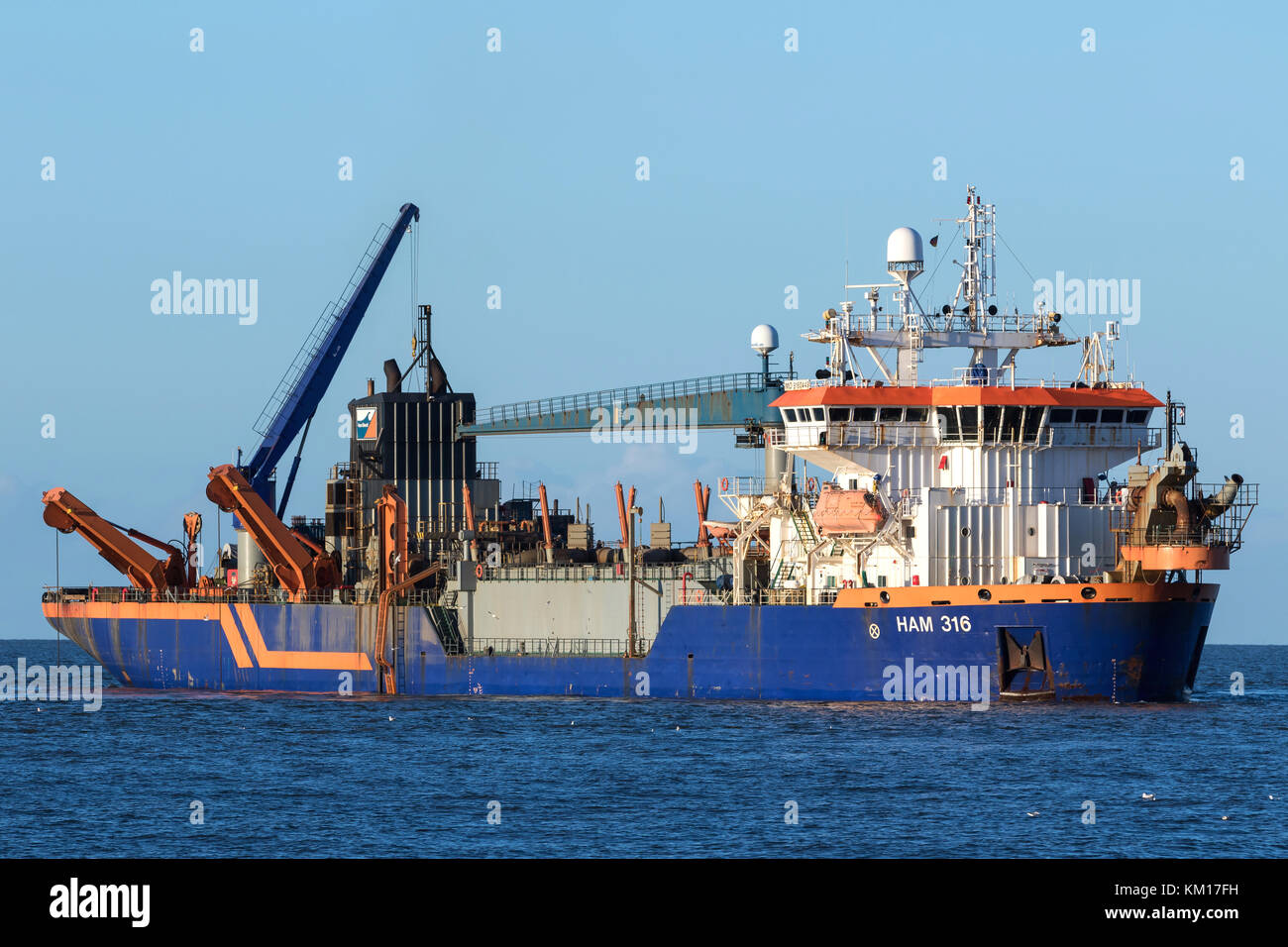 trailing suction hopper dredger HAM 316 operated by Van Oord, a Dutch contracting company with one of the world's largest dredging fleets. Stock Photo