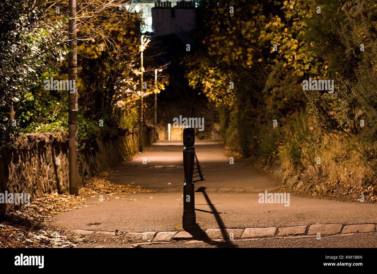 Street light illuminated path with hand rail down from Calton Hill, Edinburgh Stock Photo