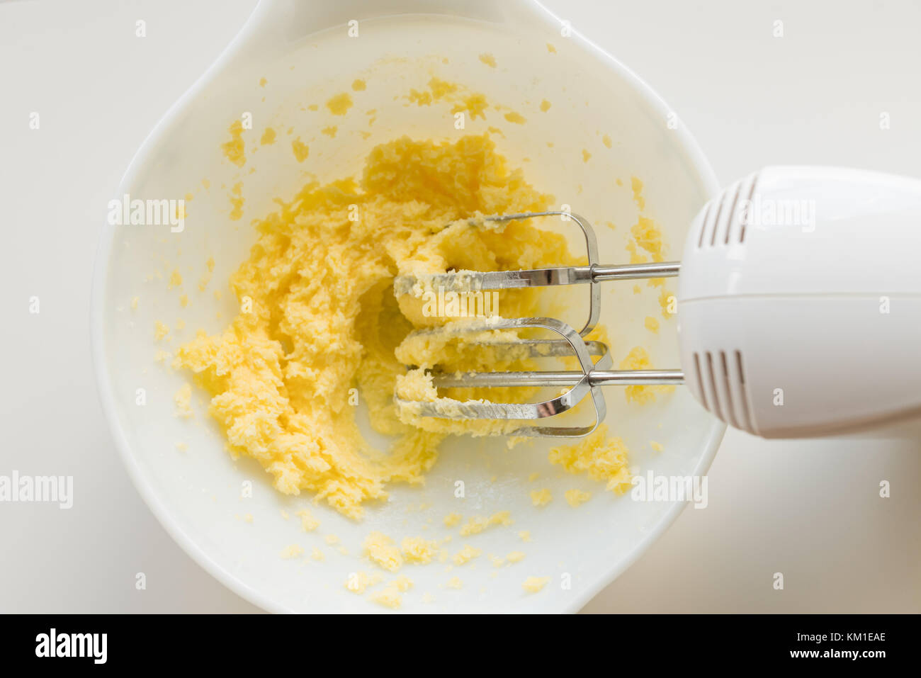Preparing cookie dough with electric beaters in bowl Stock Photo Alamy