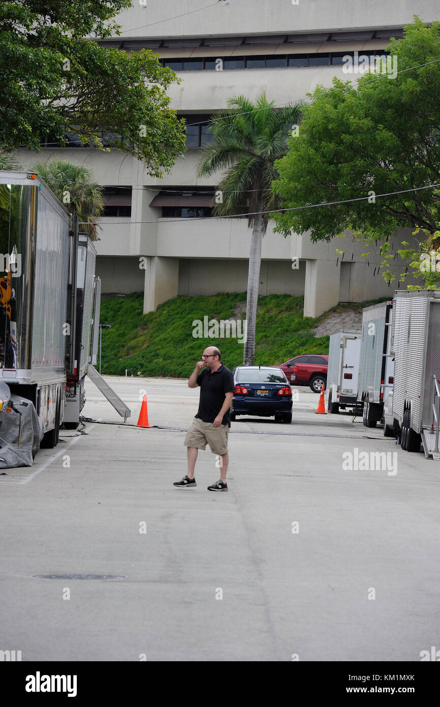 FORT LAUDERDALE, FL - JUNE 18: (EXCLUSIVE COVERAGE)   Tom Cruise refuses to be photographed on the set of Rock of Ages.  Cruise was driven around in a red golf cart (which was all covered up) and flanked by security from his trailer to the door of the club (which was like 30 feet away); fans were saying Tom, looked ridicules riding across the street rather than walking.  Everyone was very disappointed when The A list actor refused to take pictures or sign autographs, after he was heckled by fans and photogs that were screaming 'I heard this movie is going strait to video' and 'Tom I hope you d Stock Photo