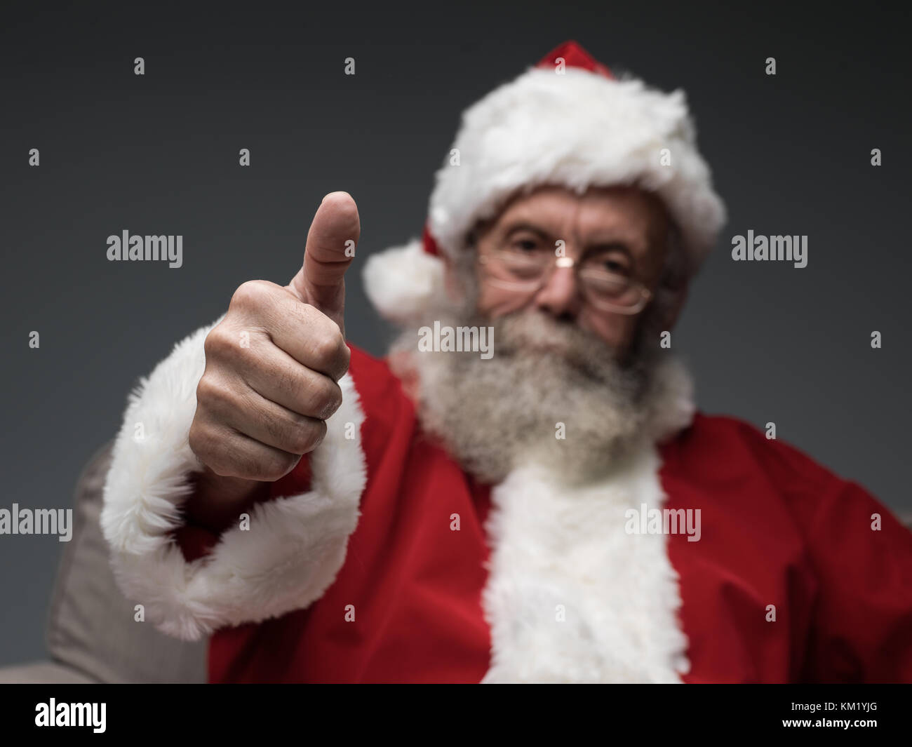 Cheerful Santa Claus giving a thumbs up, happiness and success concept ...
