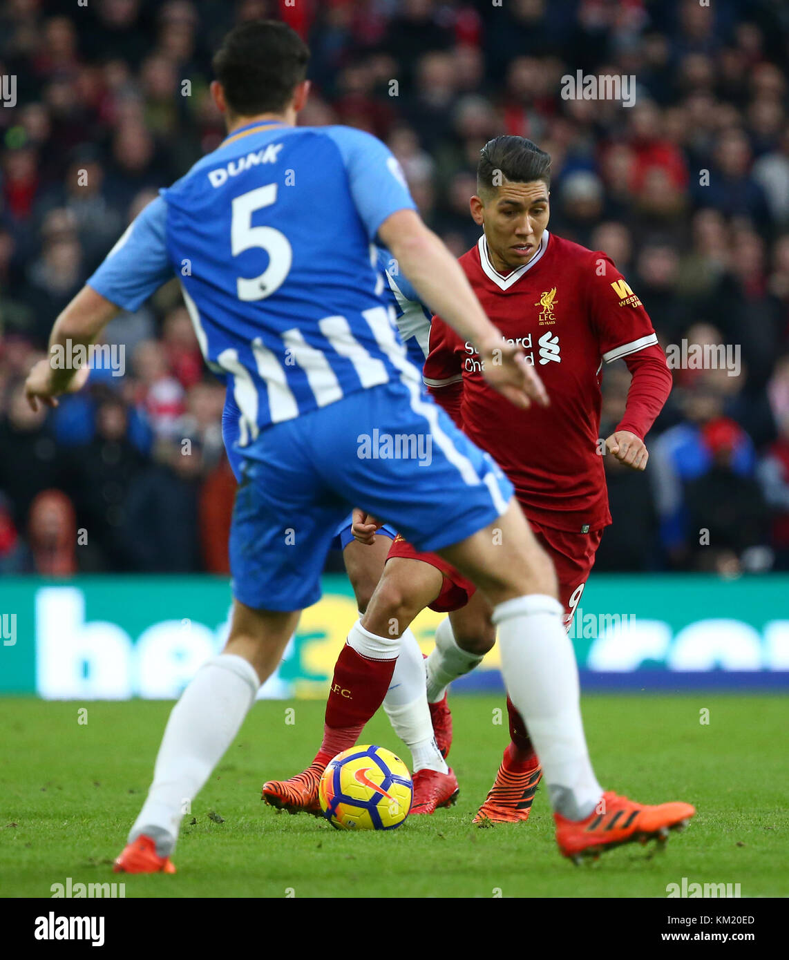 Roberto Firmino of Liverpool takes on Lewis Dunk of Brighton during the Premier League match between Brighton and Hove Albion and Liverpool at the American Express Community Stadium in Brighton and Hove. 02 Dec 2017 *** EDITORIAL USE ONLY *** FA Premier League and Football League images are subject to DataCo Licence see www.football-dataco.com Stock Photo