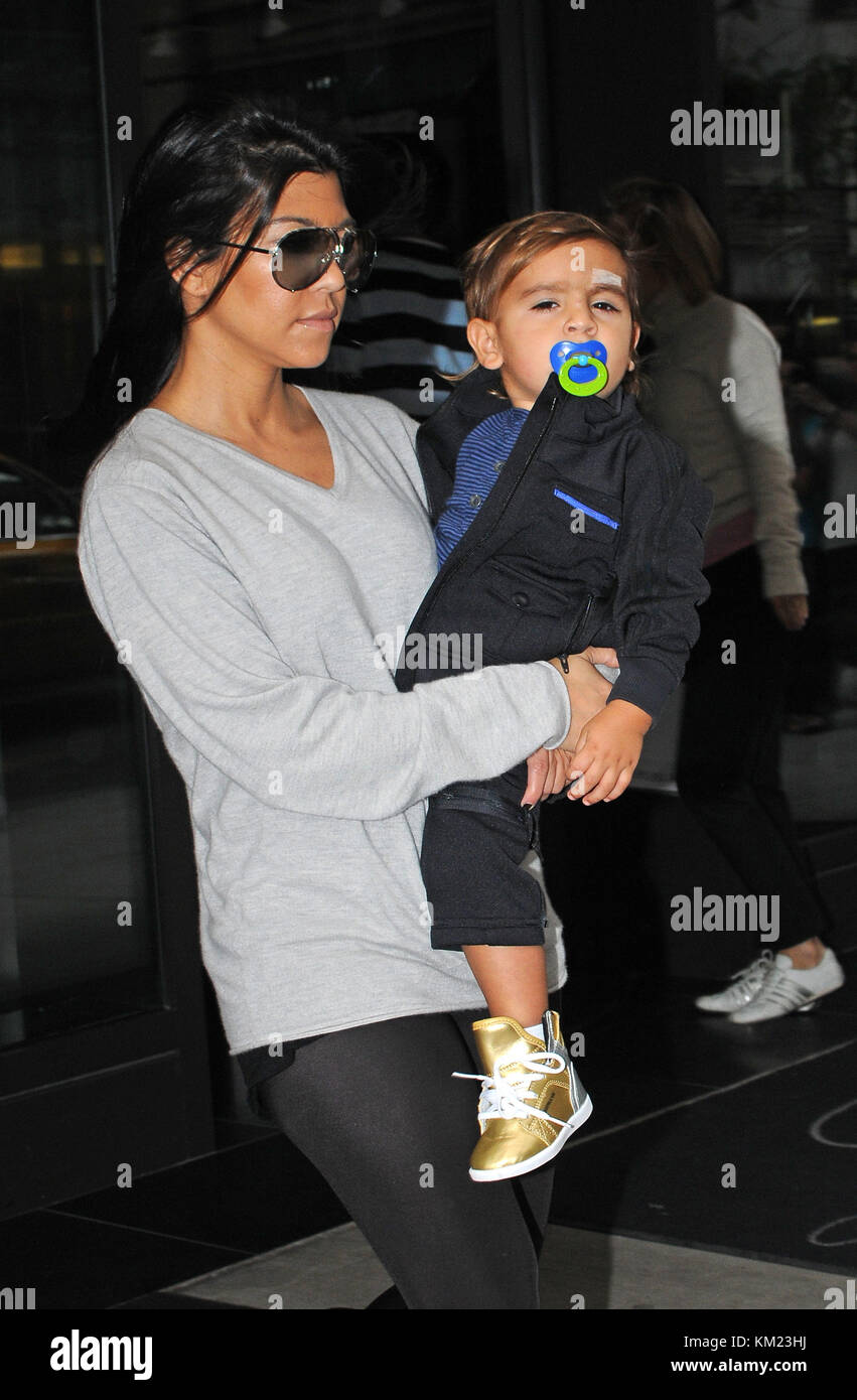 NEW YORK, NY SEPTEMBER 17 Kourtney Kardashian carries her son Mason