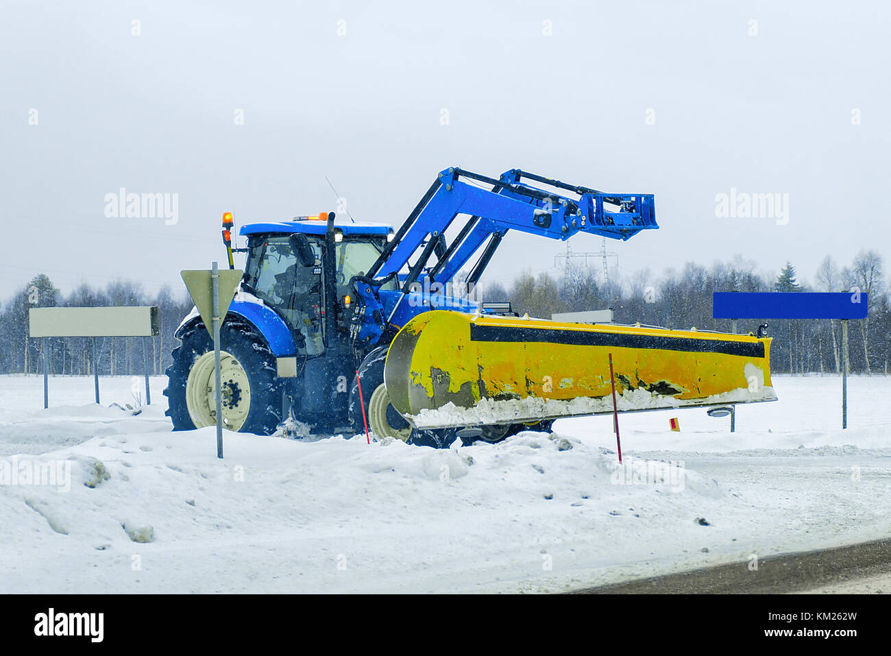 Snow removal car on the road in winter Rovaniemi, in Lapland, Finland