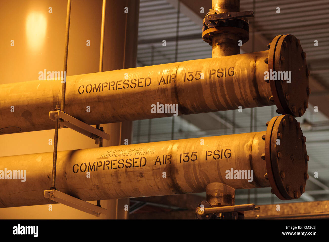 Compressed air pipes in an industrial setting Stock Photo