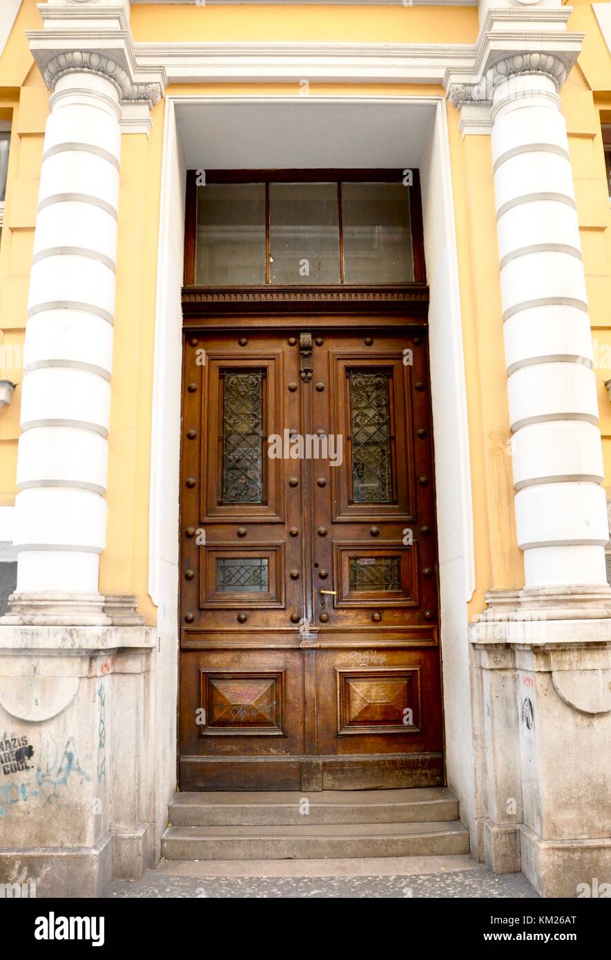 Old wooden door entrance in building in the old city of Rijeka Stock Photo