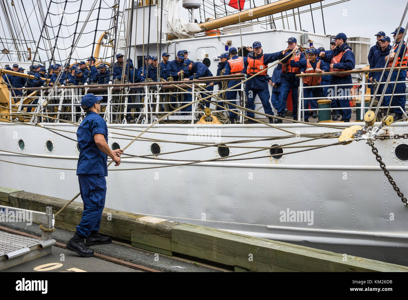 Crew of United States Coast Guard Barque 'Eagle' handling lines during arrival in Halifax, Nova Scotia, Canada for RDV 2017. Stock Photo