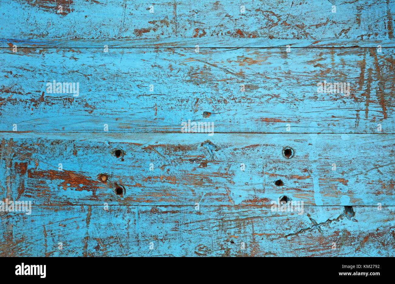 Grunge background texture of blue painted brown wood with dirty stains, scratches, wholes and cracks Stock Photo