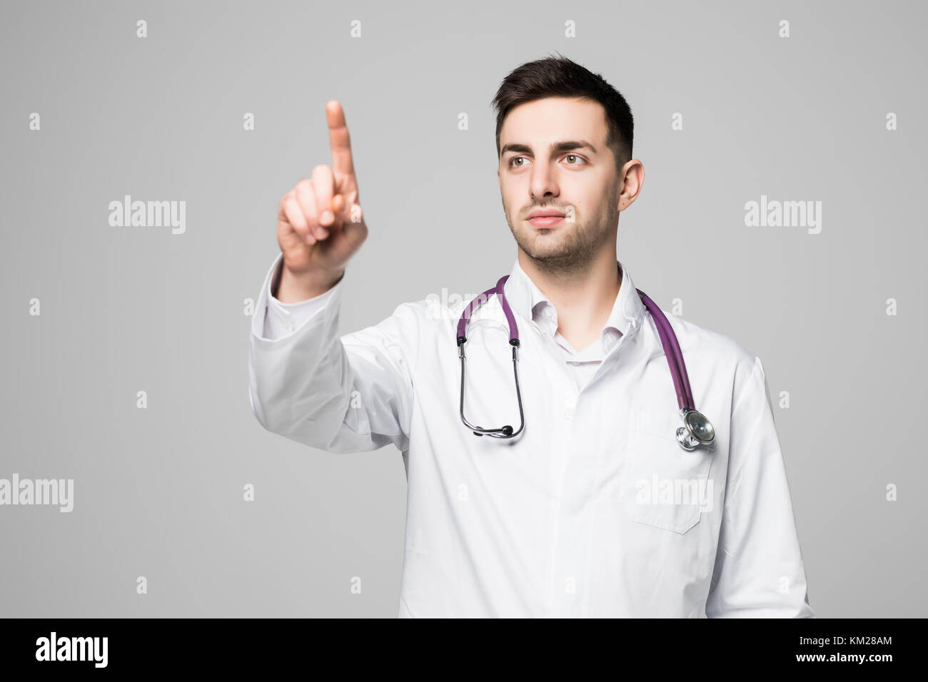 Doctor Invisible Doctor or medic pointing finger on invisible transparent screen with ...