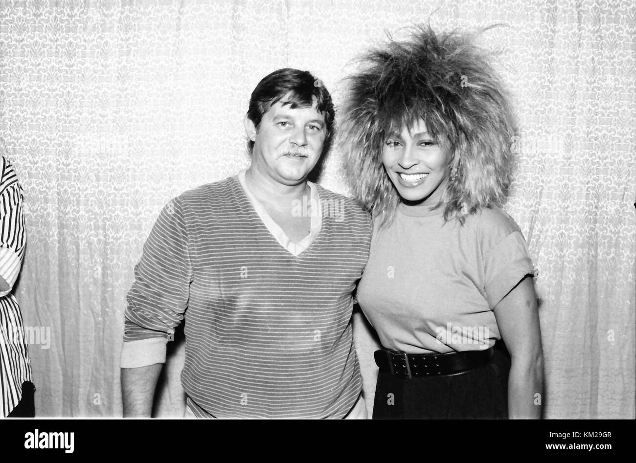OAKLAND, CA - OCTOBER 1985: Tina Turner with record executive, backstage after her concert at the Oakland-Alameda County Coliseum in Oakland, California in October 1985. Credit: Pat Johnson/MediaPunch Stock Photo