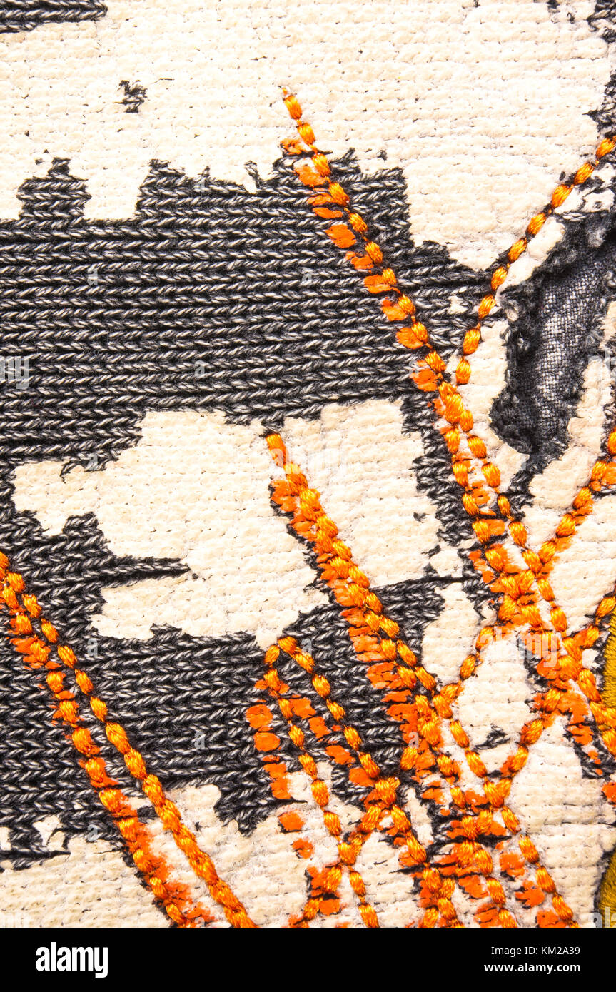 texture of a washed thick knit fabric, with decorative elements, seams