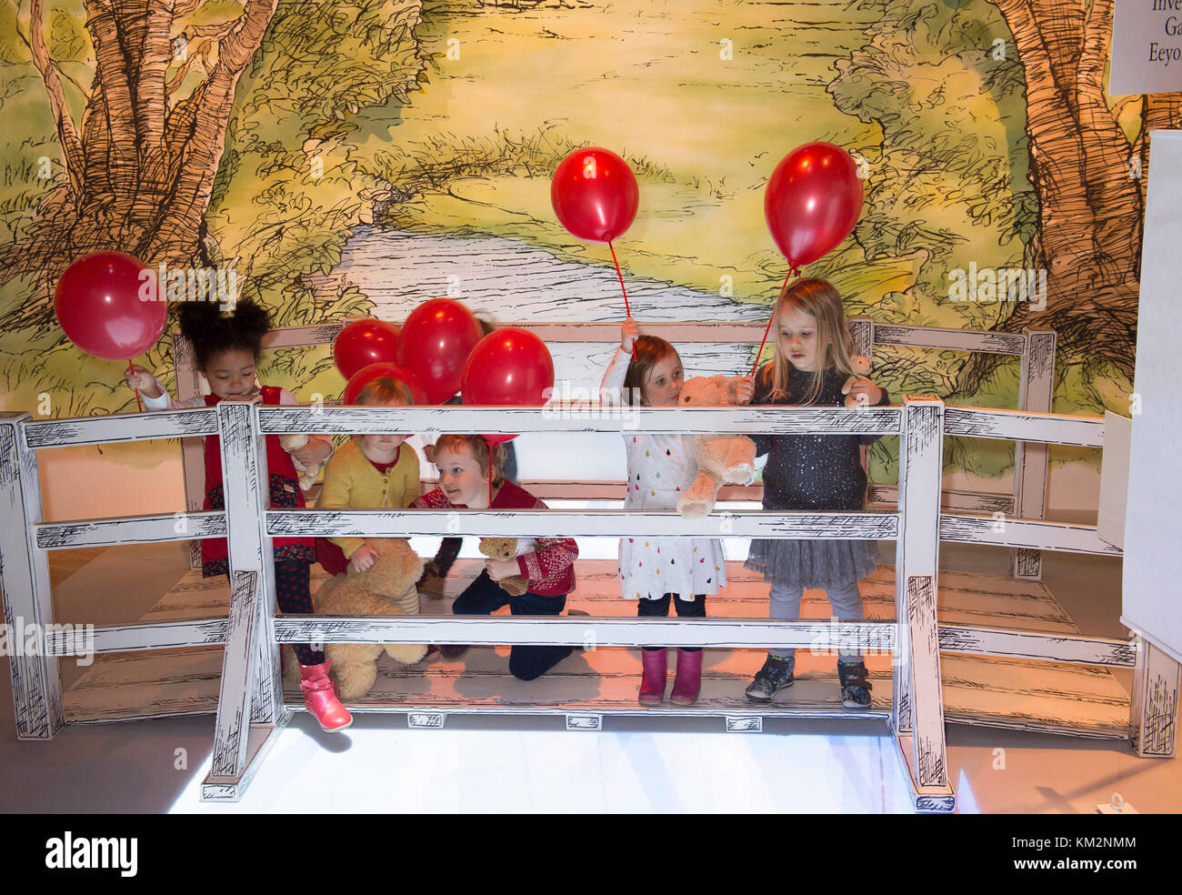 V&A, London, UK. 4 December, 2017. Young children playing and discovering the new V&A Winnie-the-Pooh: Exploring a Classic exhibition, which includes large, hand-painted backdrops of the Hundred Acre Wood and a recreation of the famous Poohsticks Bridge. The original drawings of Winnie-the-Pooh are on display at the V&A for the first time in nearly 40 years as part of the UK’s largest ever exhibition on Winnie-the-Pooh, A.A. Milne and E.H. Shepard. Credit: Malcolm Park editorial/Alamy Live News Stock Photo