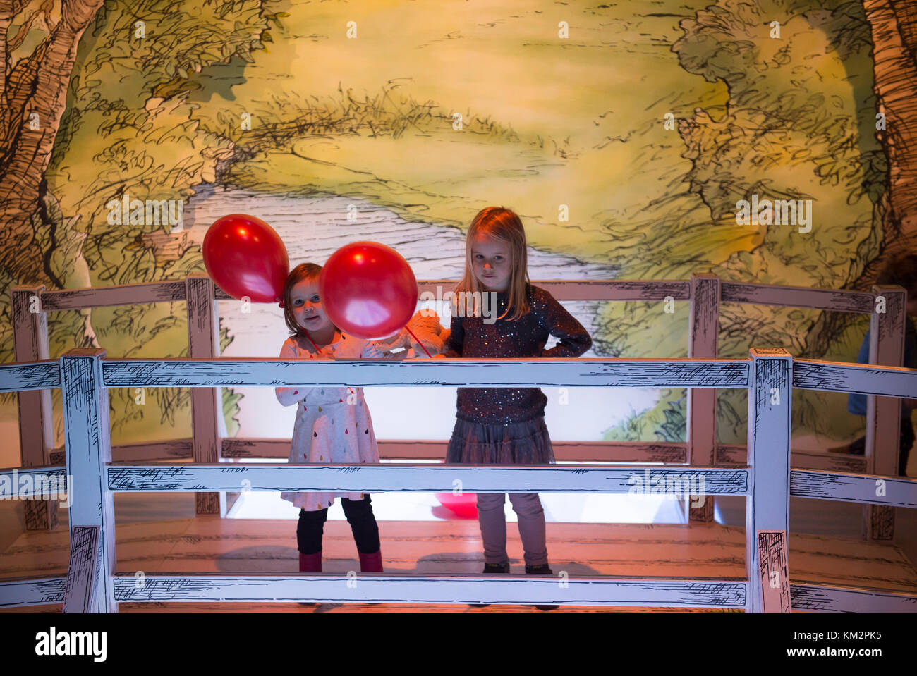 V&A, London, UK. 4 December, 2017. Young children playing and discovering the new V&A Winnie-the-Pooh: Exploring a Classic exhibition, which includes large, hand-painted backdrops of the Hundred Acre Wood and a recreation of the famous Poohsticks Bridge. The original drawings of Winnie-the-Pooh are on display at the V&A for the first time in nearly 40 years as part of the UK’s largest ever exhibition on Winnie-the-Pooh, A.A. Milne and E.H. Shepard. Credit: Malcolm Park editorial/Alamy Live News Stock Photo