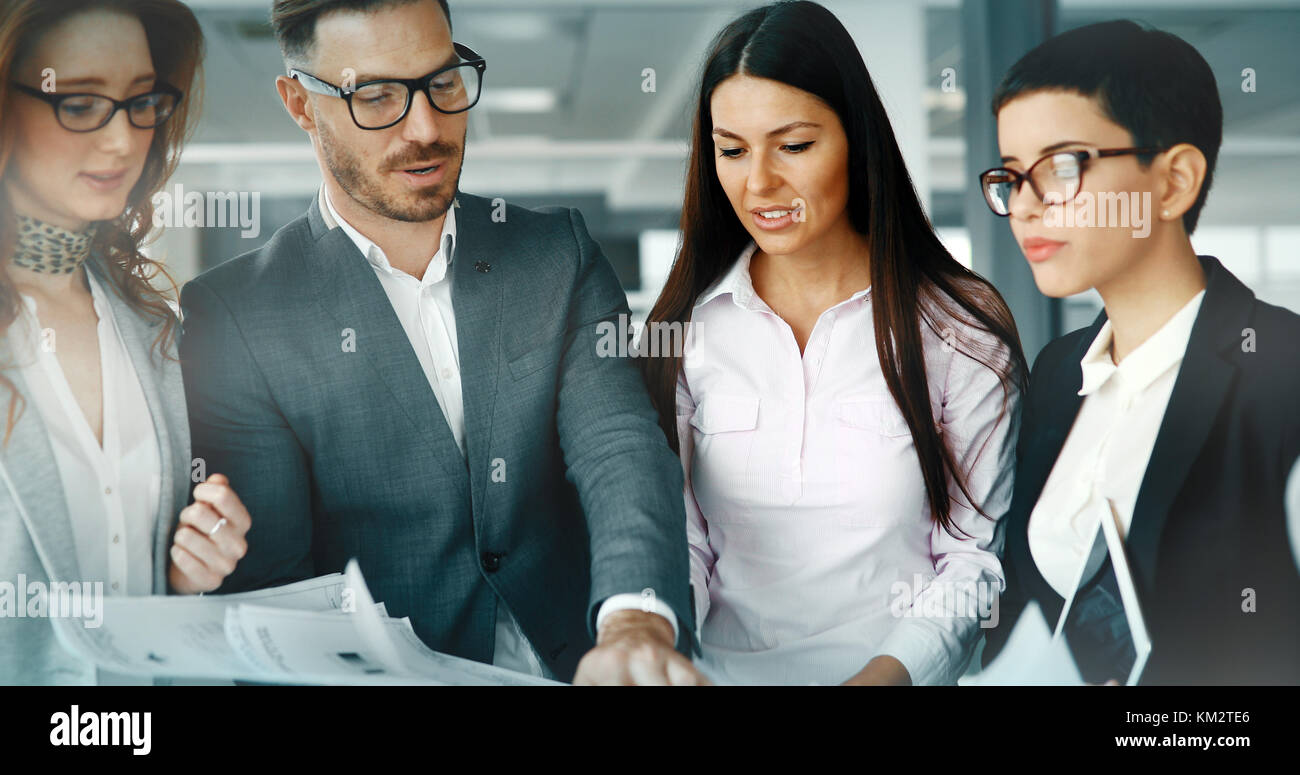 Group of business people collaborating in office Stock Photo - Alamy