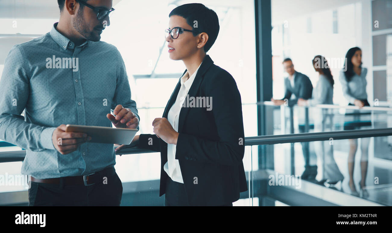 Business colleagues working together at office Stock Photo - Alamy