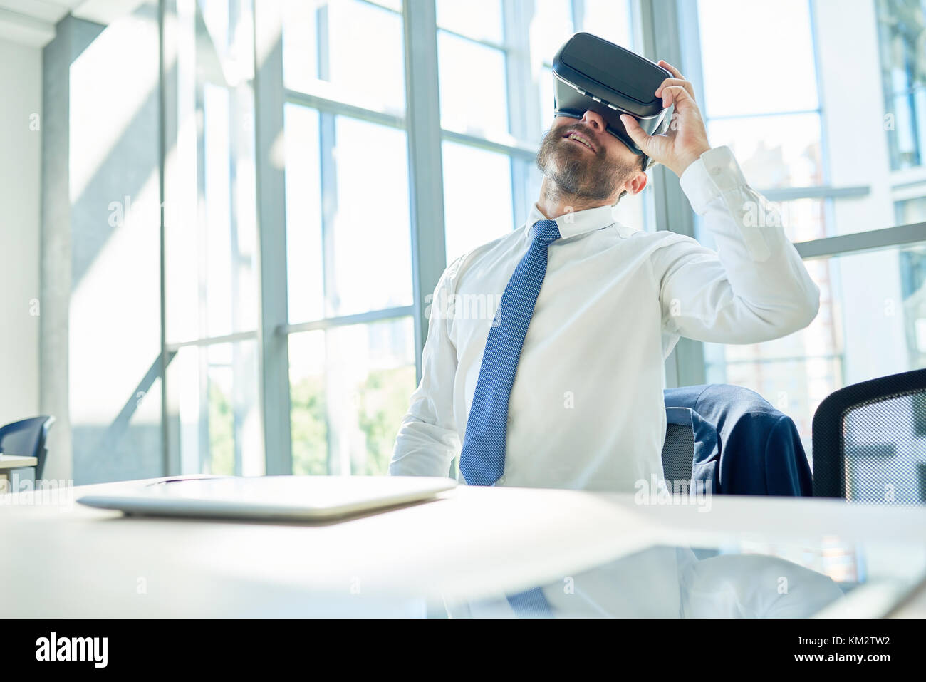 Mature Businessman Using VR Glasses in Office Stock Photo - Alamy