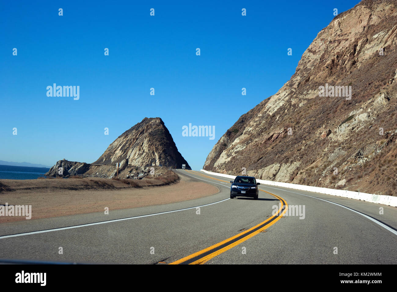 Car on Pacific Coast Highway heading south from north of Malibu to Los Angeles. Stock Photo