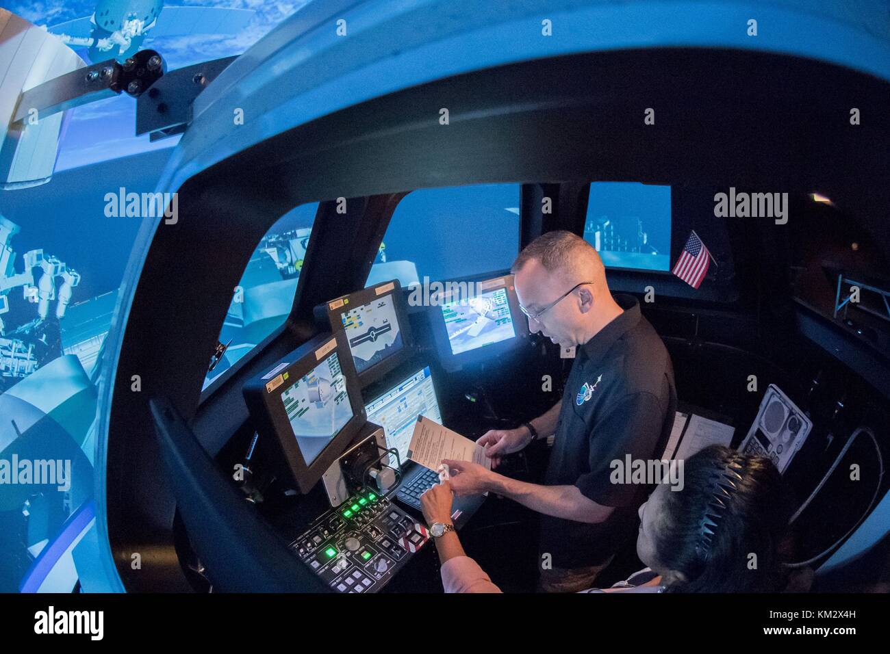 Expedition 53 American astronaut Randy Bresnik during simulation training in the Cupola robotics class in Alpha Dome at the Johnson Space Center in Houston, Texas. The simulator allows astronauts to practice the remote manipulator Canada Arm 2 without being in space. Stock Photo