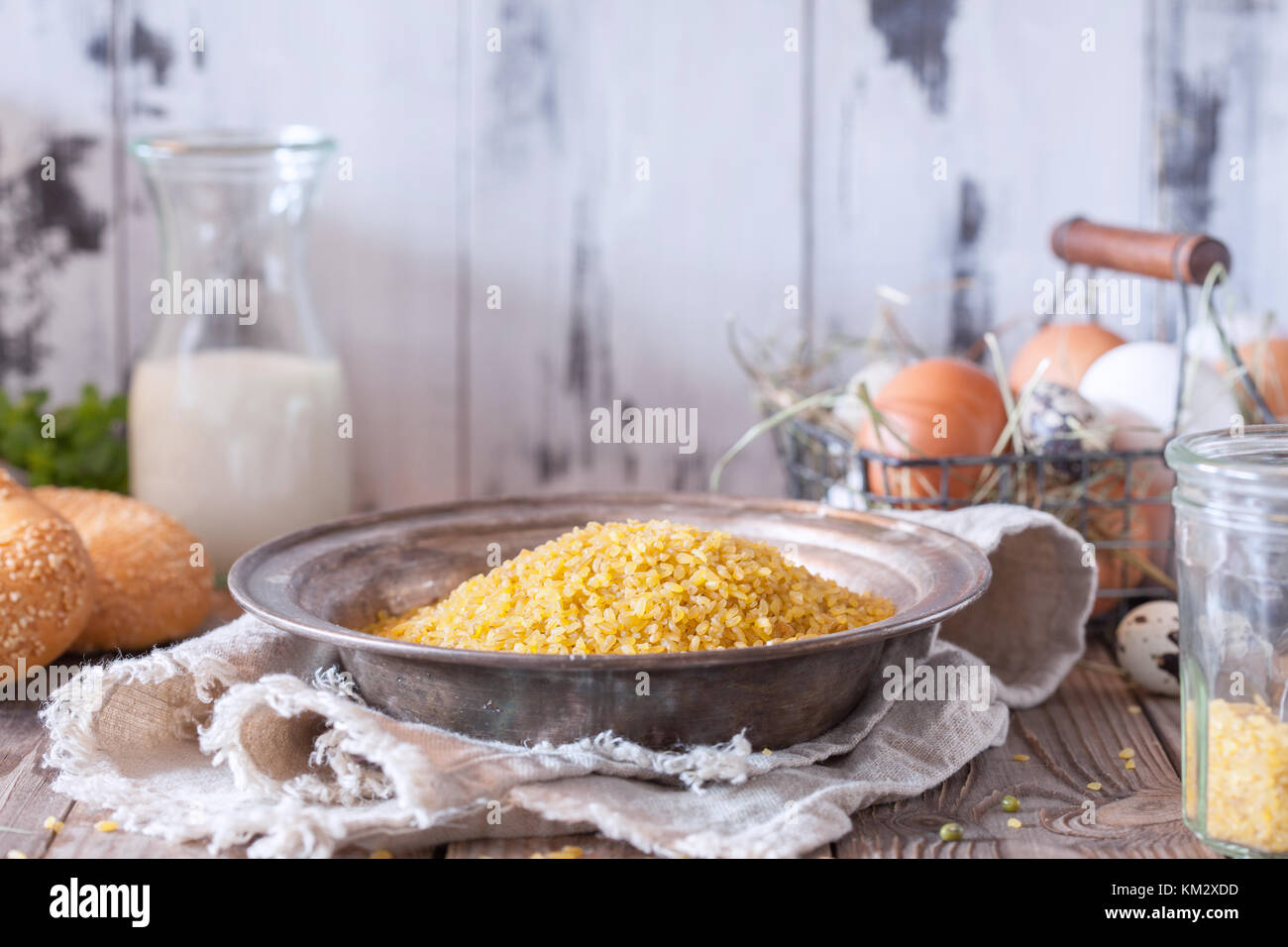 Raw bulgur heap in a metal bowl Stock Photo