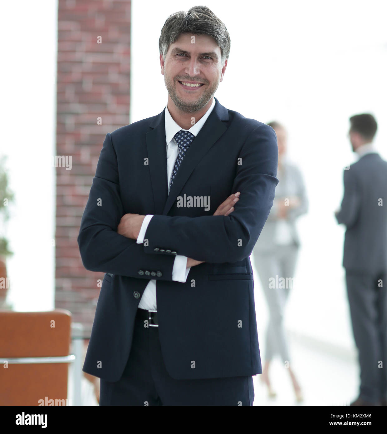 Portrait of a smiling confident businessman Stock Photo - Alamy