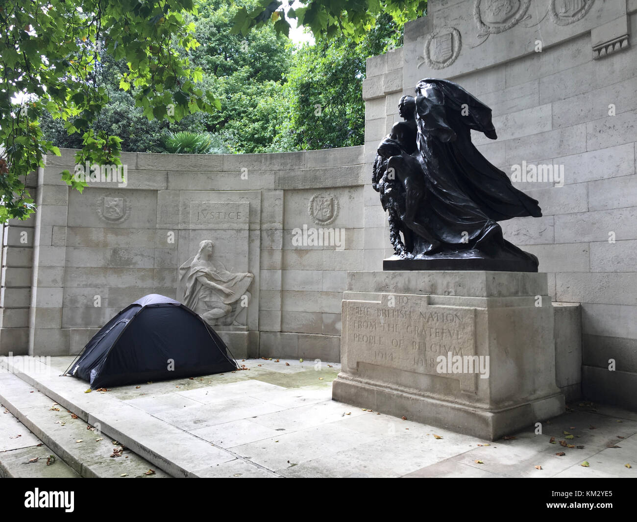 Black camping tent has been set up near the Anglo-Belgian Memorial on Victoria Embankment. Stock Photo