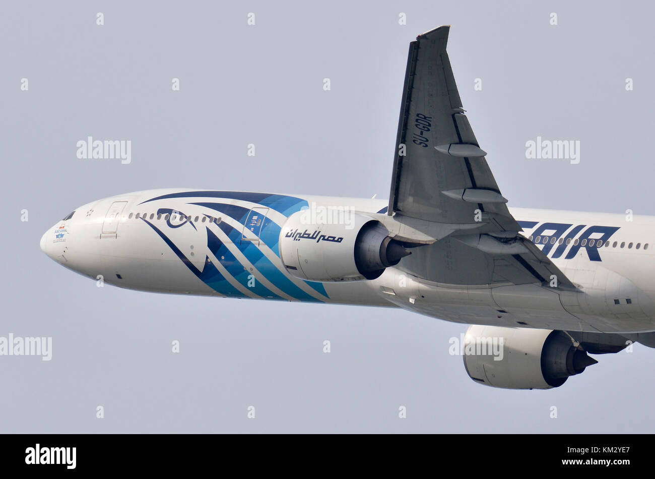 EgyptAir Boeing 777 plane with Ibis logo, Heathrow Airport, UK. Boeing 777-36N SU-GDR is seen climbing out after take-off. Stock Photo