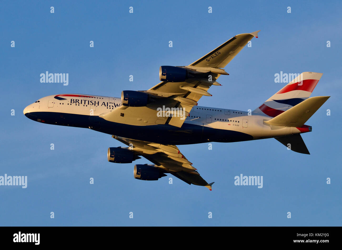 Airbus A380, British Airways, Heathrow Airport, UK. Airbus A380-841 G-XLEG is seen flying away after take-off at sunset. Stock Photo