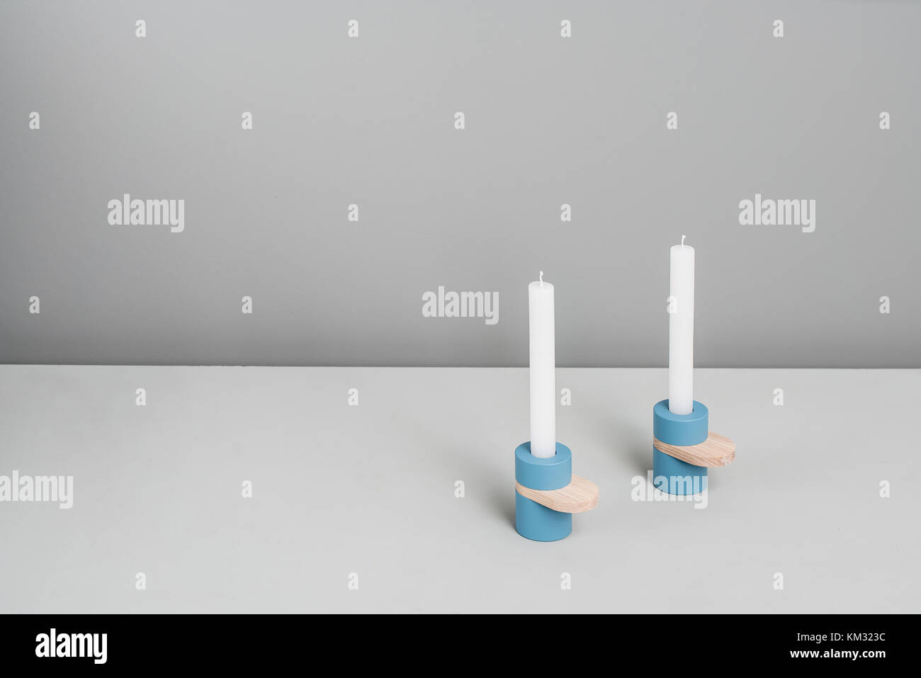 Blue candlesticks with wooden parts Stock Photo Alamy