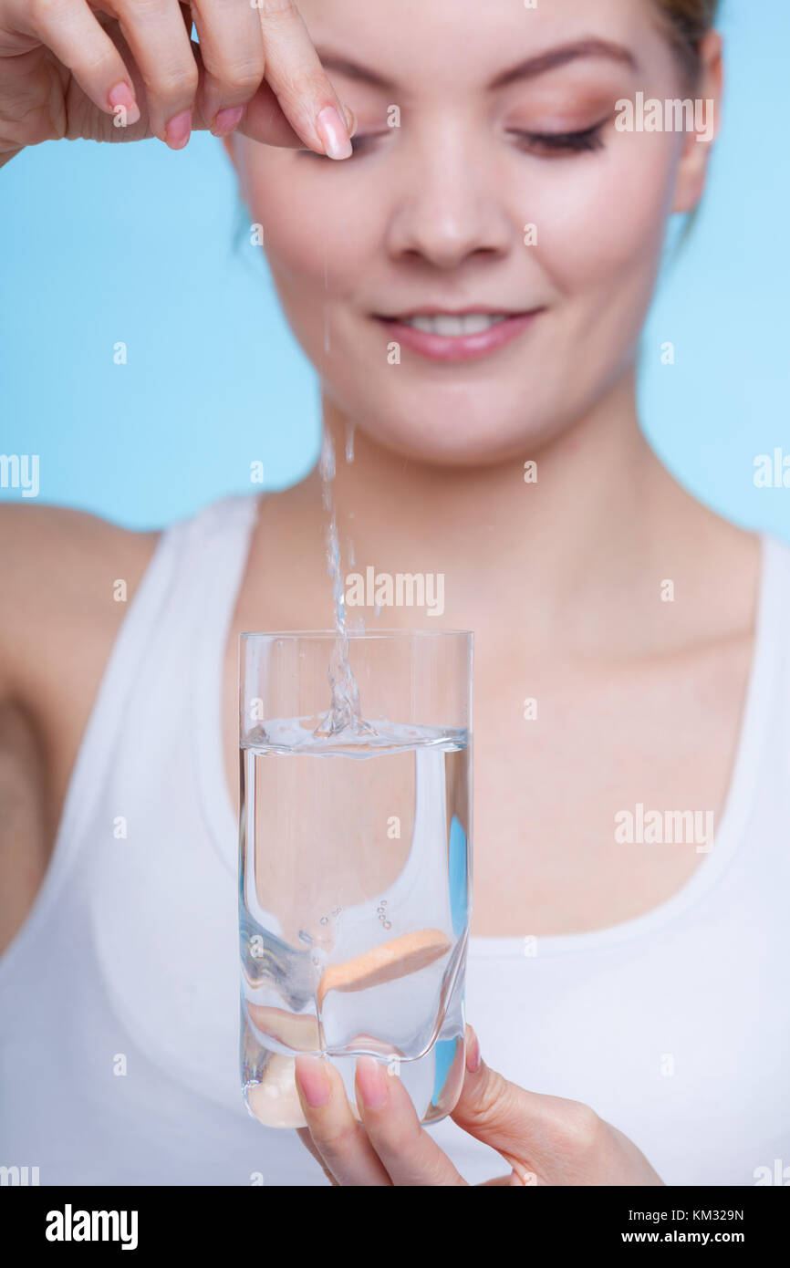 Vitamins, health, medicines. Woman throwing vitamin mineral supplement