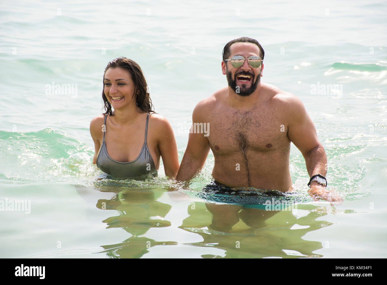 Man and woman in the Mediterranean sea Stock Photo