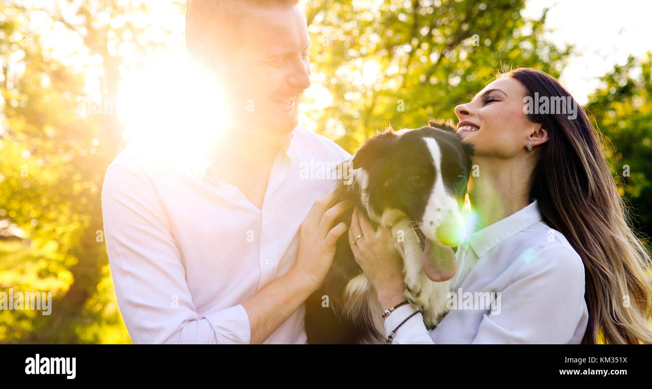Romantic couple in love walking dogs and bonding Stock Photo - Alamy