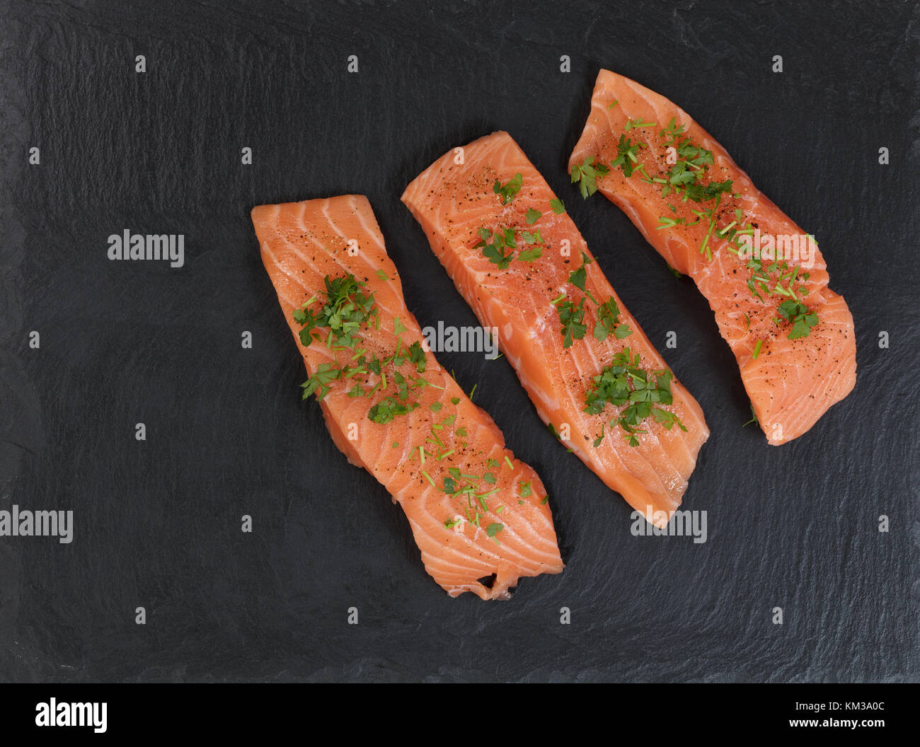 Raw wild salmon steaks on slate stone Stock Photo - Alamy