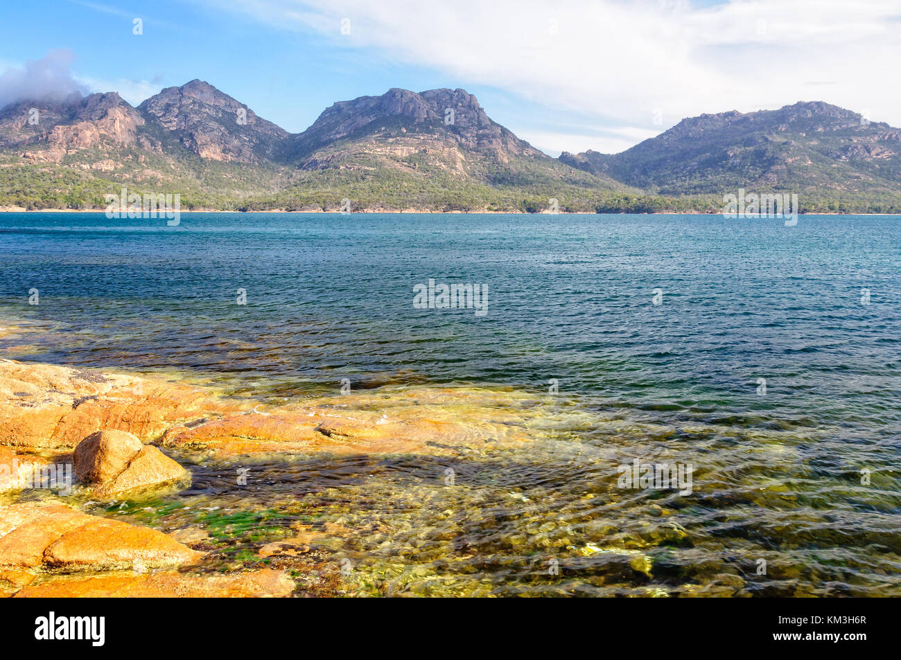 The Hazards mountain ranges in the Freycinet National Park photographed from Coles Bay - Tasmania, Australia Stock Photo