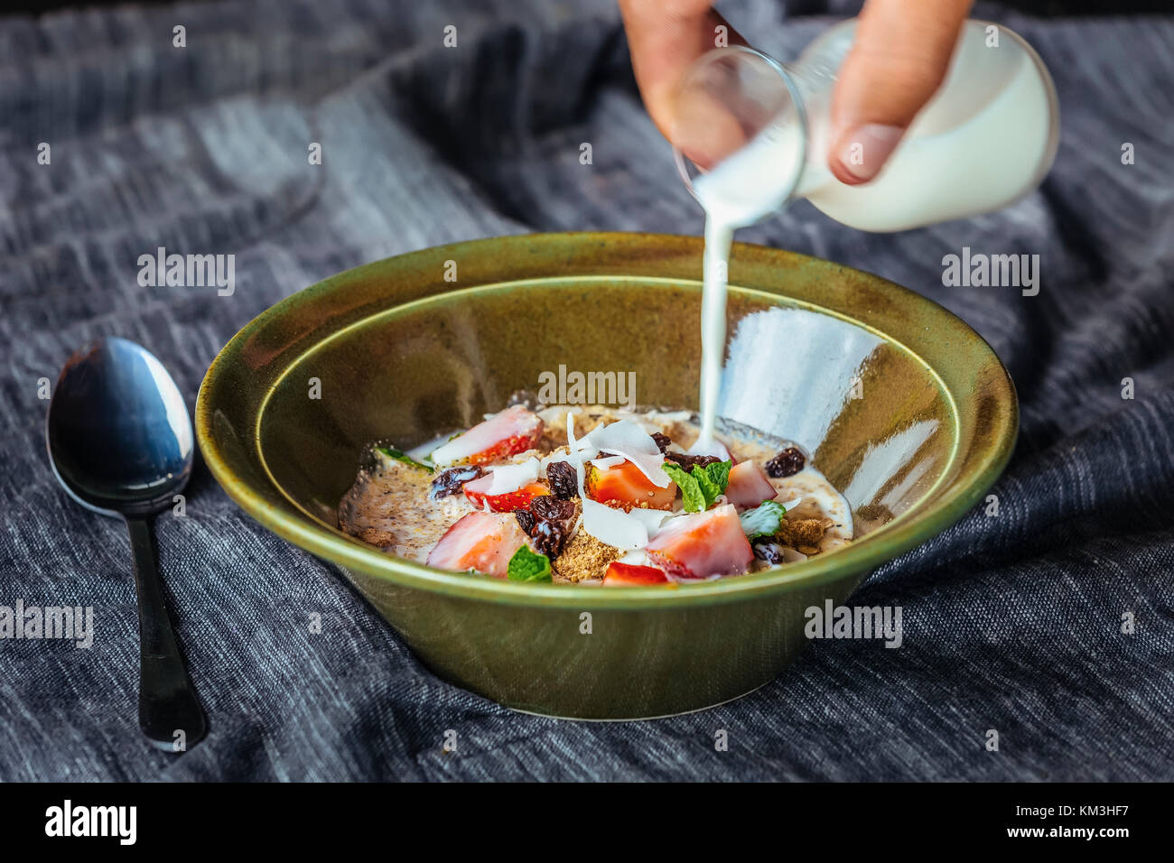 Granola. Granola with milk and berries on the table. Stock Photo