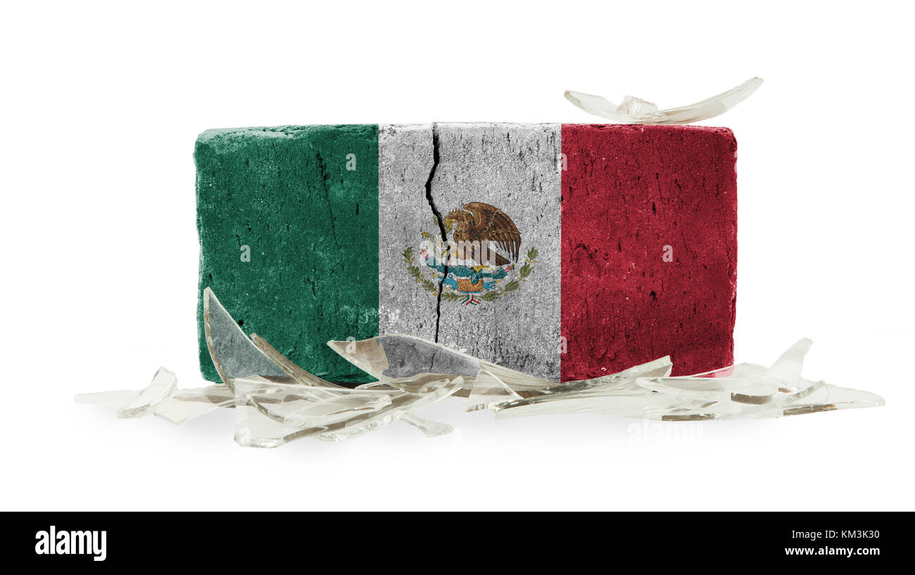 Brick with broken glass, violence concept, flag of Mexico Stock Photo