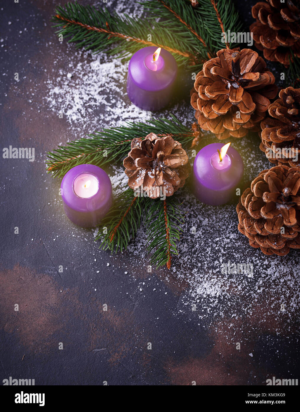 Pine cones and candle Stock Photo - Alamy