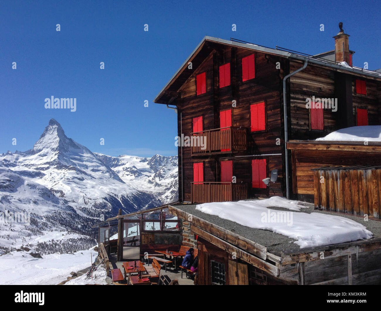 View of Matterhorn and Fluhalp hut in front of a blue sky Stock Photo
