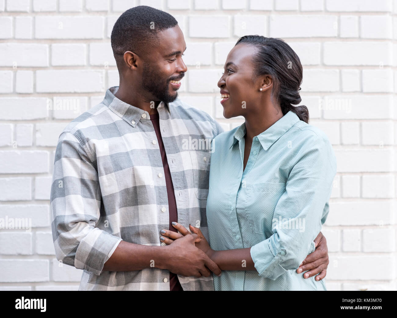 Affectionate young African couple standing together in the city Stock Photo