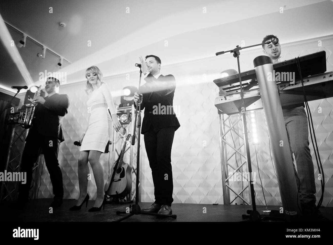 Musicial music live band performing on a stage with different lights Stock Photo Alamy