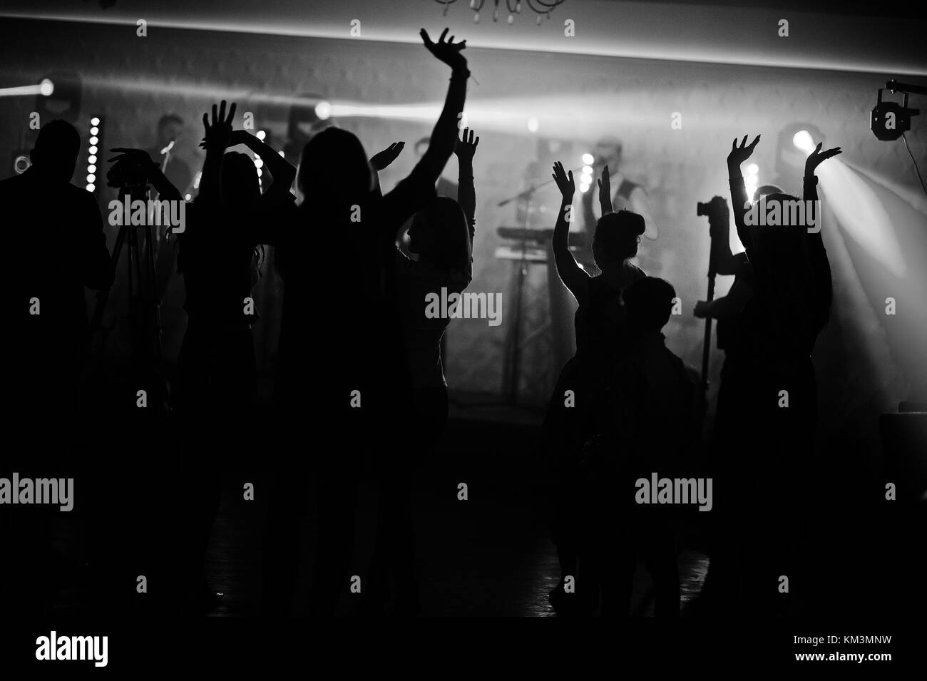 Musicial music live band performing on a stage with different lights