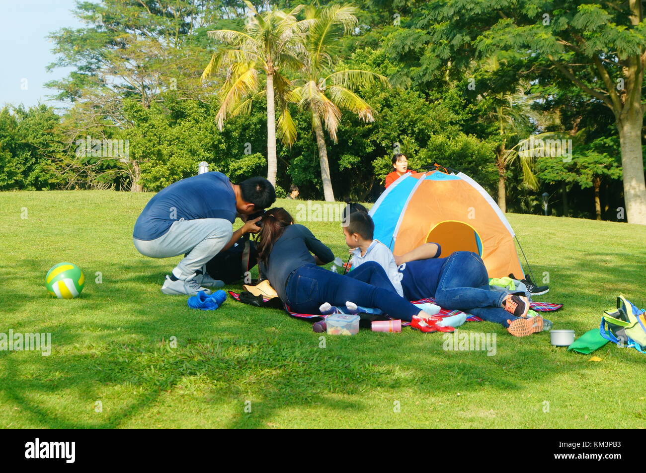 Outdoor lawn tourists set up tents leisure tourism Stock Photo Alamy