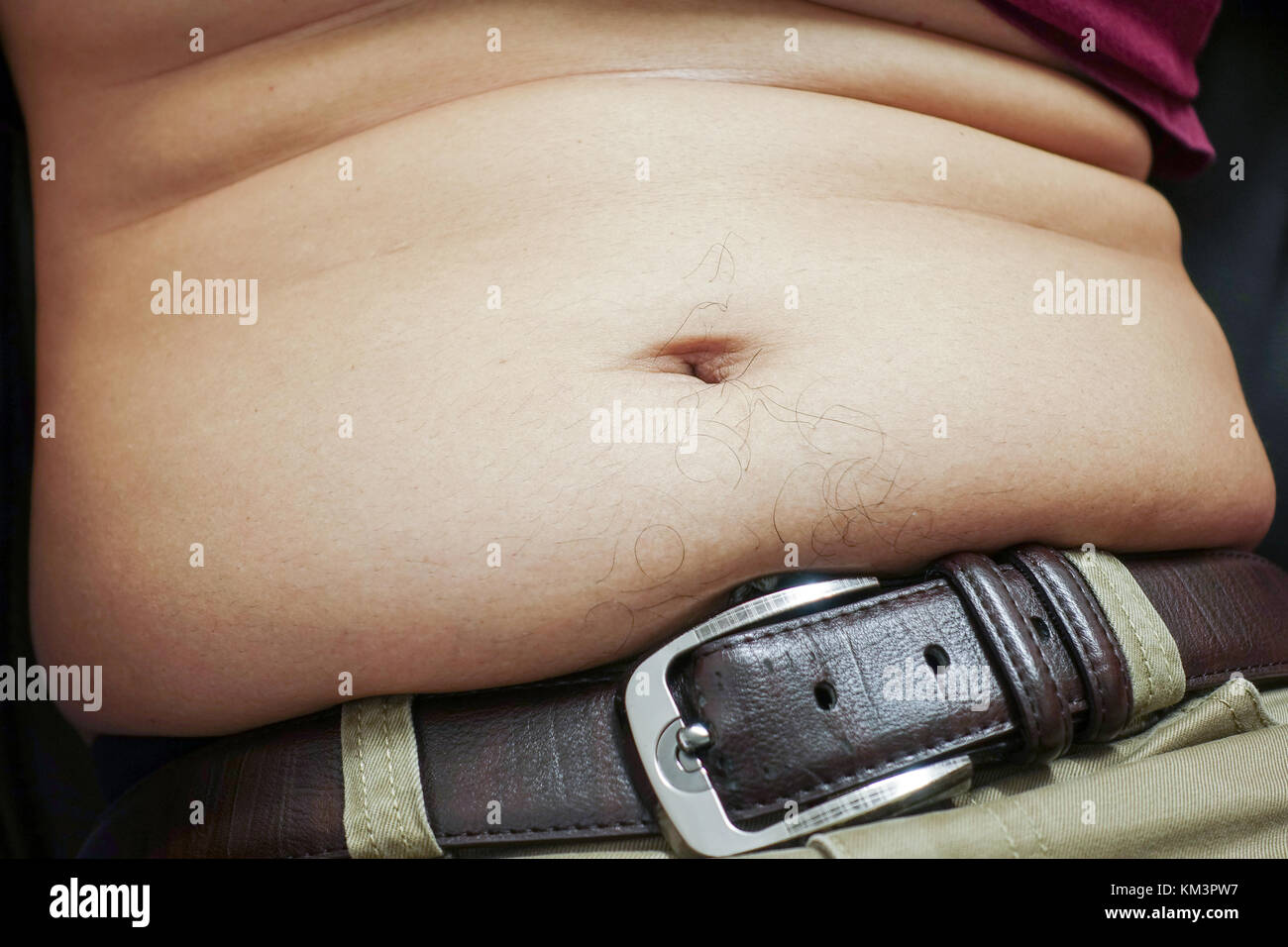 belly of a fat man - closeup Stock Photo