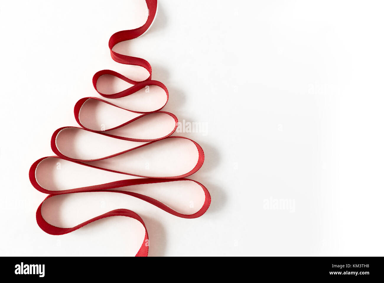 Bright red ribbon christmas tree horizontal greeting card isolated on