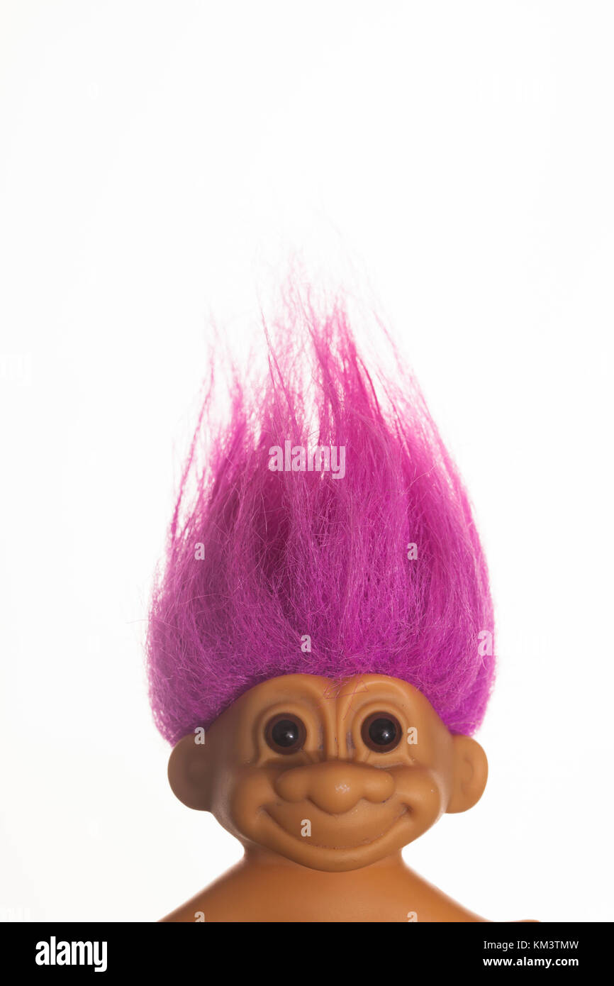 LONDON, UK - DECEMBER 4th 2017: An original troll plastic toy figure with bright coloured hair. First produced in Denmark by Thomas Dam Stock Photo