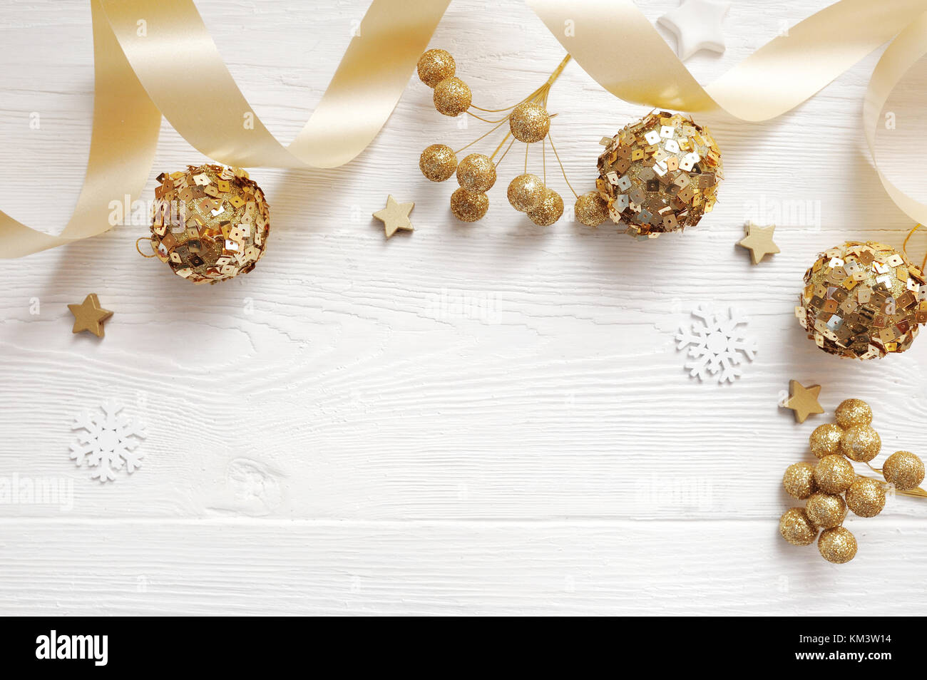 Mockup Christmas decor top view and gold ball, flatlay on a white wooden background with a ribbon, with place for your text Stock Photo