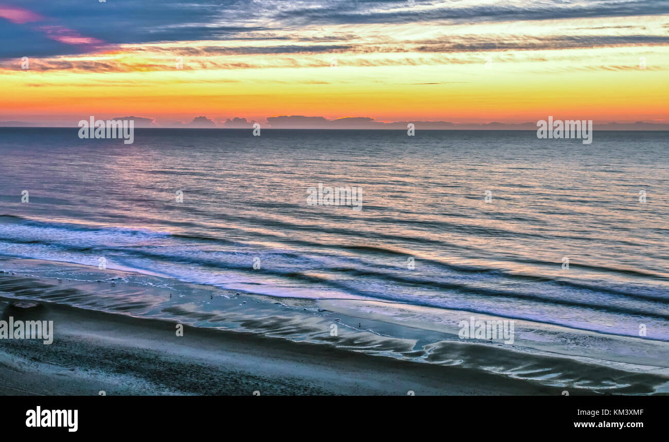 Myrtle Beach Scenic Beach Background Atlantic Ocean beach with waves, water and a scenic sunset horizon background. Myrtle Beach, South Carolina, USA. Stock Photo